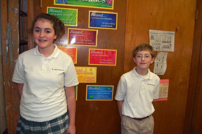 By TERRY AHNER/TIMES NEWS  St. John Neumann Regional School Palmerton campus students Elizabeth Kester (Grade 8) and Elijah Koma (Grade 6) placed third in their respective grade levels during the District 5 CYO Spelling Bee last week at the school.