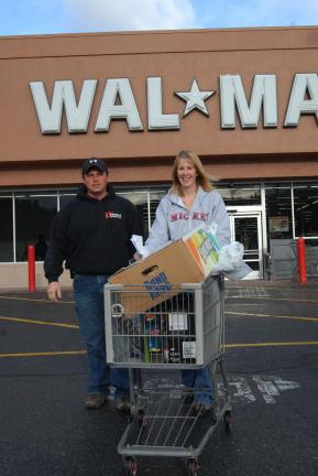 RON GOWER/TIMES NEWS After the Black Friday shopping crunch subsided a bit, Jamie and Lisa Keys of Brodheadsville were able to work on their Christmas list at the Lehighton Wal-Mart.