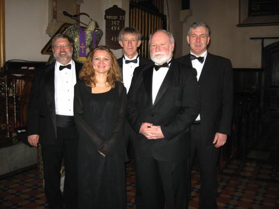 Randall Perry, conductor of the Bach and Handel Chorale, stands with the soloists from the chorale's Christmas Concert. Front row, from left, are Angela Mosley, soprano; and Dan Evans, bass. Back row, Perry; Ed Sayre, bass; and Brad Lizotte, tenor.