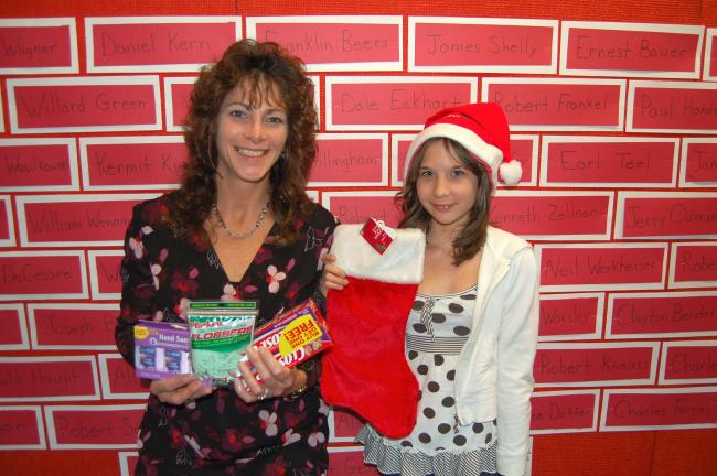 LINDA KOEHLER/TIMES NEWS Sue Mendes, a third grade teacher at Slatington Elementary School coordinated the Veteran's Day assembly that so inspired sixth grader, Chelsey Snyder to cash in savings bonds to buy things to send to the troops in Iraq and…