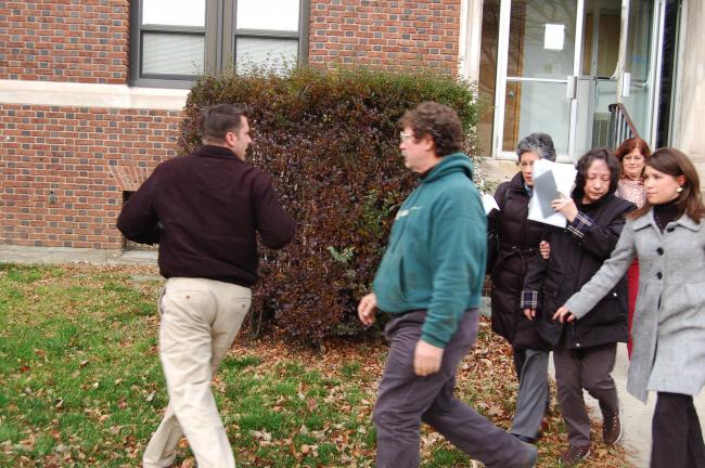 TERRY AHNER/TIMES NEWS Former Lower Towamensing Township secretary Dorothy Achey (attempting to cover her face) is joined by family members as she exits the office of District Judge Bruce Appleton of Palmerton on Wednesday. Achey waived her right to…