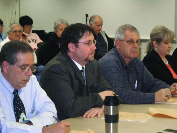 LIZ PINKEY/SPECIAL TO THE TIMES NEWS Panther Valley High School Principal George Gillespie, center, submitted his resignation as principal, effective Jan. 15, 2010. The school board accepted his resignation at last night's meeting. At this time,…