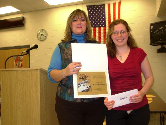 Amanda Breidenbach, right, is the recipient of the annual 4-H Jensen Award. It was presented by 4-H educator Sherri Abbruzzi.