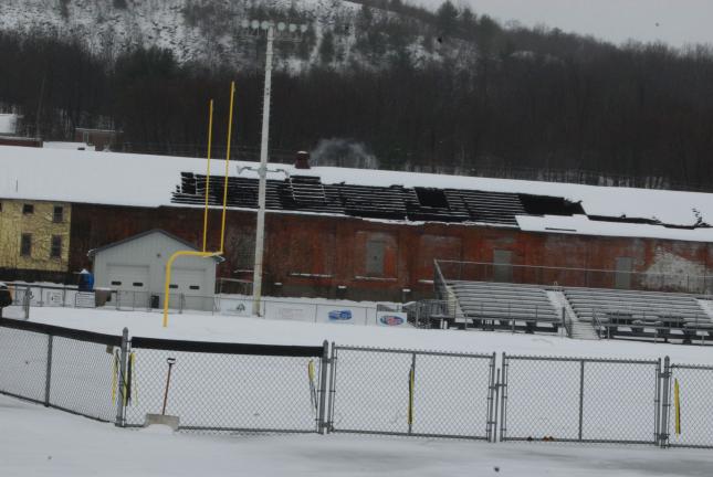 RON GOWER/TIMES NEWS This building owned by Ben Verta of Lansford, located adjacent to the Panther Valley football stadium, is missing a large section of its roof. District Justice Casimir Kosciolek of Lansford delayed ruling on 14 citations issued…