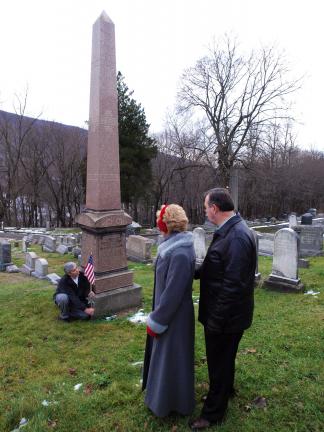AL ZAGOFSKY/SPECIAL TO THE TIMES NEWS Jim Holleran, left, past Commander of the American Legion Post in Jim Thorpe, places a Civil War marker and flag on the grave site of Charles Albright, a Mauch Chunk lawyer who rose to the rank of brevet General…