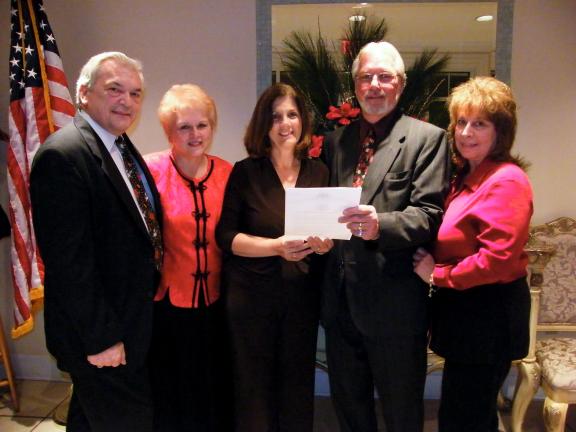 CAROL ZICKLER/SPECIAL TO THE TIMES NEWS During the Carbon County Redevelopment Authority meeting held at Macaluso's, the late Dick Merluzzi a 30 year member, was honored. His son, Bill will take over on the board for hislate father. Seen left to…