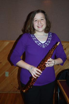 LINDA KOEHLER/TIMES NEWS Stephanie Spatz, 16, of Mertztown, won a Kenny G soprano saxophone at the Kenny G concert at Penn's Peak.
