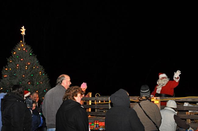 VICTOR IZZO/SPECIAL TO THE TIMES NEWS Children and residents gathered at the Sam Miller Field on North Avenue on Saturday evening in the Heights section of Jim Thorpe for the annual Christmas tree lighting ceremony and a visit from Santa Claus who…