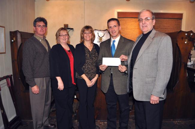 AMY ZUBEK/TIMES NEWS Members of the Summit Hill Lions Club present Micah J. Gursky, director of development at St. Luke's Miners Memorial Hospital, second from right, with a check in the amount of $1,000. The club pledged a total of $5,000 over the…