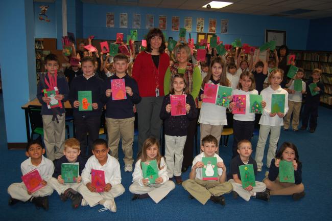 JOE PLASKO/TIMES NEWS Students in grades 1-3 at Rush Elementary School, Hometown, have made Christmas cards for the crew of the USS Ardent, stationed in the Persian Gulf. Some of the students who participated include, front row from left, Nathaniel…