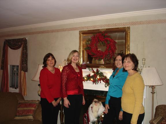 MARY TOBIA/SPECIAL TO THE TIMES NEWS Left to right, Susan Dewalt, Palmerton Concourse Club member and guide, Christine Campbell, Club president and guide, Cindy Gasper, homeowner and Club member and Gwen Ebbert, guide, stand by the festively…