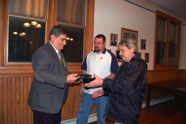 TERRY AHNER/TIMES NEWS Palmerton Borough Councilman Chris Olivia (at left) presents citations to residents Larry Mertz (center) and Dean Messinger (at right) after council adopted a resolution for their role during a dispute that occurred over the summer.