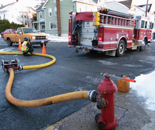 ANDREW LEIBENGUTH/SPECIAL TO THE TIMES NEWS The Tamaqua Area Water Authority and the Tamaqua fire company have connected gas-powered water pumps to fire hydrants in Dutch Hill to help improve pressure for the residents of Dutch Hill while they…