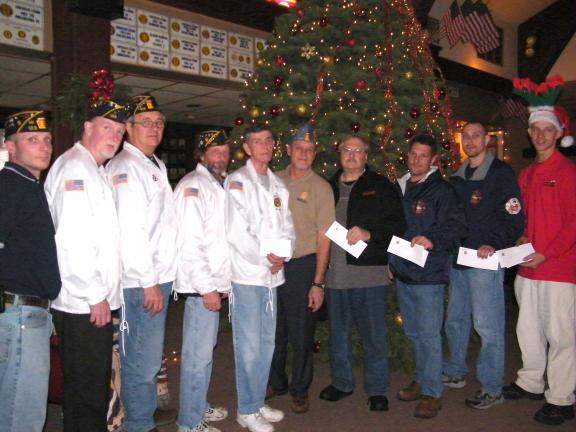 ANDREW LEIBENGUTH/SPECIAL TO THE TIMES NEWS Pictured during the Lansford American Legion Post 123 check presentations, from left, are Lansford American Legion Jr Vice President Jay Doyle, Commander Bill Coll, Vice Commander Dav Padora, Lansford…