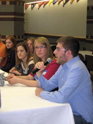 STACEY SOLT/SPECIAL TO THE TIMES NEWS Shane Haydt, right, speaks during the Lehighton Winter Social. Last year's seniors, now college freshmen, were invited back to the high school to discuss college life. To his left are Catherine McEvilly, middle,…