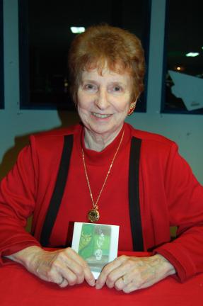 LINDA KOEHLER/TIMES NEWS Darlene Hyde holds a copy of the ornament she painted that is now hanging on a Christmas tree in the Renwick Gallery of the Smithsonian American Art Museum's craft and decorative arts program.
