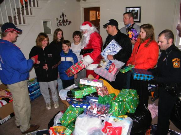 ANDREW LEIBENGUTH/SPECIAL TO THE TIMES NEWS Many organizations came together just 24 hours after a tragic fire to help the Valentine family, which lost its belongings to a fire in Tamaqua Wednesday. Some of the volunteers providing donations to the…
