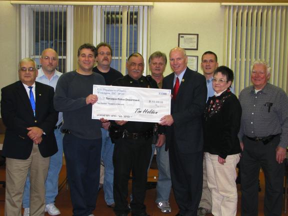 LIZ PINKEY/SPECIAL TO THE TIMES NEWS U.S. Rep. Tim Holdenpresented the Borough of Tamaqua with a $200,000 check as part of a grant from the U.S. Department of Justice. Accepting the check were, front, from left, Councilman Tom Cara, Mayor Christian…