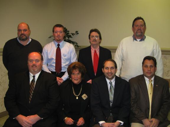 RICK GRANT/SPECIAL TO THE TIMES NEWS Kyle Scheckler, front row, left to right, Joanne Klitsch, Gregory Strubinger, Mayor Michael Sofranko. Back row: W. Todd Mason, President Justin Yaich, Joseph Marzen, Vice-President John McGuire.
