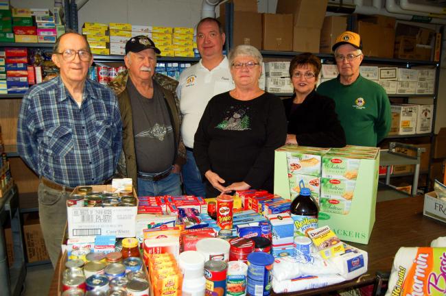 LINDA KOEHLER/TIMES NEWS Left to right: Charlie Silliman, coordinator of CACPAC, Dell Swartz, CACPAC volunteer, Linda Swartz, president of CACPAC, are ready to stock the CACPAC shelves with groceries they were able to buy from money that was donated…