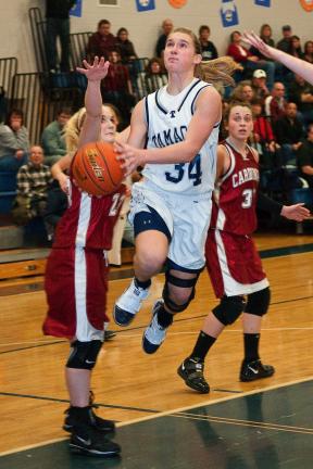 Steve Shinko/Special to the TIMES NEWS Tamaqua's Allison Updike goes for two as Pine Grove's Corrine Ryan reaches for a block during Thursday's basketball game at Tamaqua.