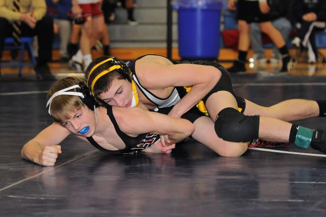 STEVE SHINKO/special to the TIMES NEWS Panther Valley's Nick O'Donnell (top) works on Pottsville's Bailey Roos in the 103 pound weight class finals at the Schuylkill League Wrestling Tournament.