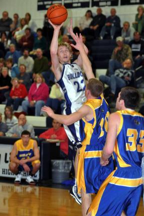 MIKE FEIFEL/TIMES NEWS Northern Lehigh's Jordan Waylen takes a jump shot over Wilson's Chris Cooper (10).