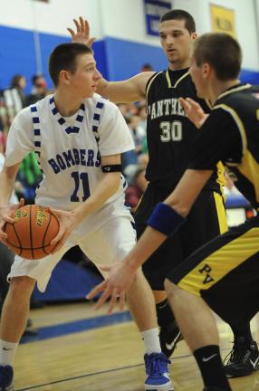 NANCY SCHOLZ/Special to the TIMES NEWS Palmerton's Tyler Svetik looks for help as he is double-teammed by Panther Valley's Damien Lewis (30) and Kyle Picht.