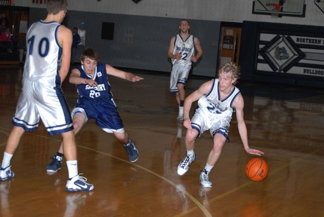 Ron Gower/TIMES NEWS Northern Lehigh's Jordan Waylen, right, gets a screen from teammate Joey Seremula (10) to get around Salisbury defender Alec Ressler.