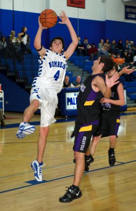 BOB FORD/TIMES NEWS Palmerton's Ben Andrews (4) drives in for a shot as Trevor Kalinkos of Palisades watches at right.