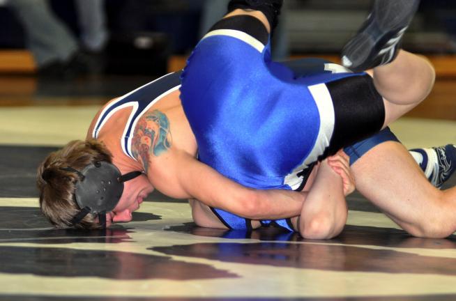MIKE FEIFEL/TIMES NEWS Northern Lehigh's Nikko Stevens puts Palmerton's Tony Gardo on his back for a fall in 37 seconds.