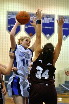 MIKE FEIFEL/TIMES NEWS Pleasant Valley's Amber Chieffo takes a shot over Lehighton's Sheena White in last night's 50-48 OT win.