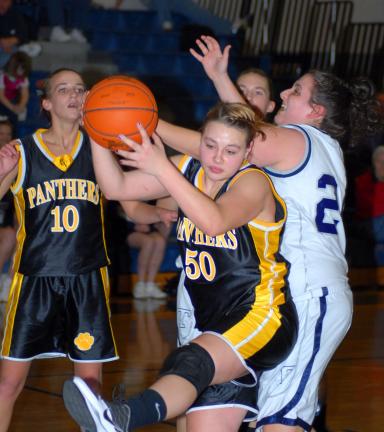 Ron Gower/TIMES NEWS Panther Valley's Sam Zlock (50) appears to have won this battle for a rebound with Tamaqua's Cassie Eroh. Looking on is PV's Dana McFadden.