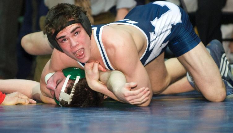 BOB FORD/ TIMES NEWS Northern Lehigh's Chris Christ (top) tries to rack up some back points against Rex Lutz of Pen Argyl in the 145-pound bout. Lutz used a takedown at the buzzer to pull out an 8-7 decision