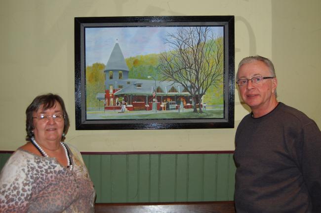 LINDA KOEHLER/TIMES NEWS Thanks to the owner of the Jonas Hotel, Mike Pandolfo, Margie Long is displaying her artwork, like her painting of the old train station in Jim Thorpe, as the Artist of the Month at the hotel.