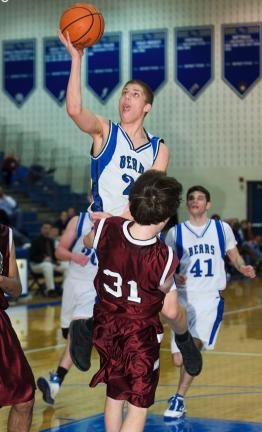 bob ford/times news Pleasant Valley's Richie Irving goes over Stroudsburg's Steve Poorman on a drive to the basket. Irving was called for a charging foul on the play.