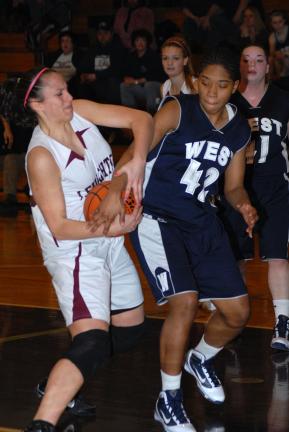 RON GOWER/TIMES NEWS Lehighton's Sheena White pulls the ball away from Pocono Mountain West's Shana Clark during Saturday's MVC showdown.