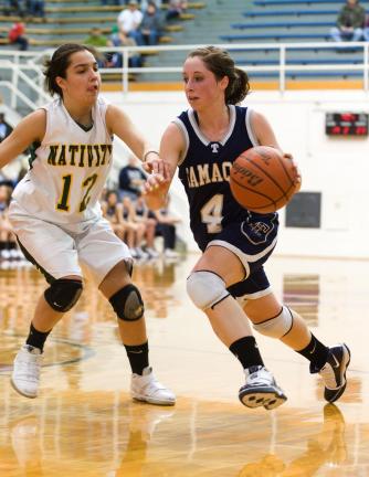 bob ford/times news Tamaqua's Kayla Hope (4) takes the ball to the basket against Kiely Chaklos of Nativity.