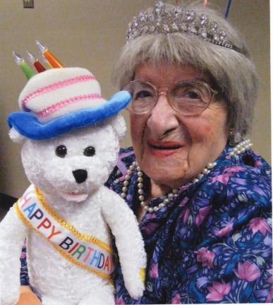 Lucie Carpenito shares a warm smile as she celebrates her 100th birthday.