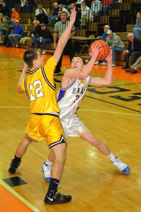 steve shinko/special to the times news Mahanoy Area's Michael Gaval (12) tries to block a pass by Marian's Chris Barletta.