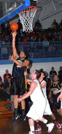 RON GOWER/TIMES NEWS Panther Valley's Brock Mitchell lays up a shot from under the basket.