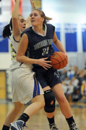 nancy scholz/special to the times news Northern Lehigh's Sonya Josephson goes hard to the basket against Wilson defender Colleen Touhey.