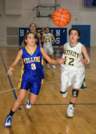 steve shinko/special to the times news Marian's Angela Bellezza (3) and Nativity's Kiely Chaklos (12) chase after a loose ball during Wednesday's District 11 Class A semifinal game at Minersville.