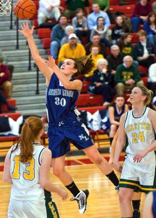 STEVE SHINKO/Special to THE TIMES NEWS Central Catholic defenders Abby Guman (13) and Colleen Nosovitch (24) watch as Northern Lehigh's Lauren Oertner goes to the basket during Saturday's District 11 Class AAA Championship game in Easton.