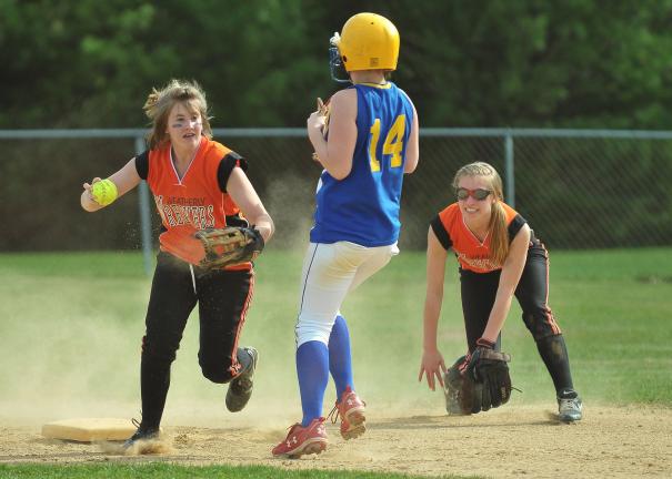 Marian's Kayla Knight (14) is forced out at second base as Weatherly's Erin Dougherty looks to complete a double play. Looking on for the Lady Wreckers is Taylor Shortway (right).