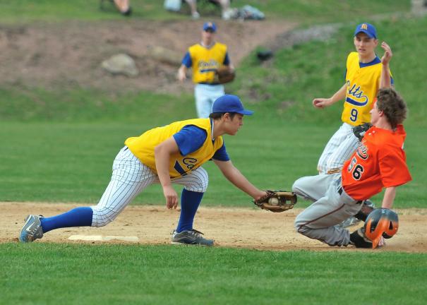 steve shinko/special to the times news Marian's Joe Kloap (9) looks on as Weatherly's Cody Hoffman slides around a tag attempt by the Colts' Mark Stawick during Wednesday's game at Weatherly.