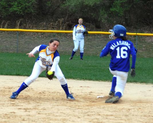 RON GOWER/TIMES NEWS Marian shortstop Abbie Burkhardt doesn't get the ball in time to tag Sarag Walasavage of Minersville at second base.