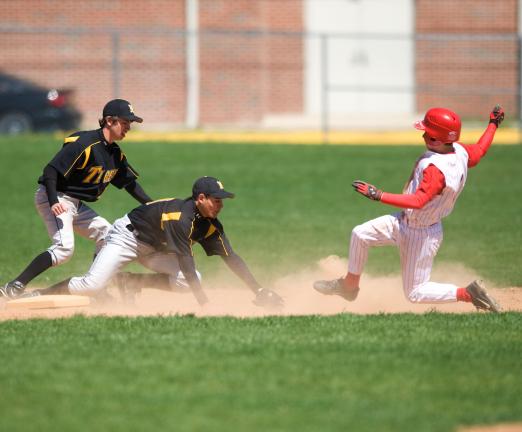 BOB FORD/TIMES NEWS Jim Thorpe's Zac Knox slides in to second base safely as Andrew Rivera of Northwestern Lehigh waits for the throw with teammate Sean Nagle backing up.