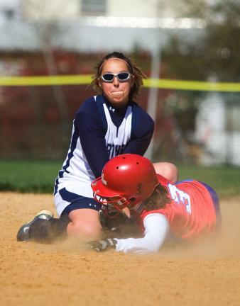 BOB FORD/TIMES NEWS Northern Lehigh shortstop Kristi Seiler puts the tag on Jim Thorpe's Amber Fiducia. Fiducia was throw out trying to steal second base.