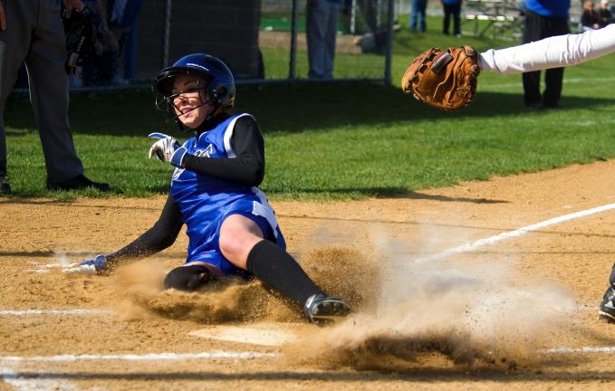 bob ford/times news Alura Bellis of Pleasant Valley slides safely across the plate.